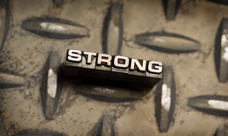 The word Strong done in vintage letterpress type. See my portfolio for similar images.の写真素材