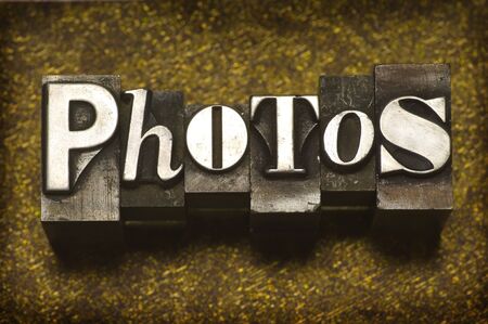 The word Photos in letterpress typeの写真素材