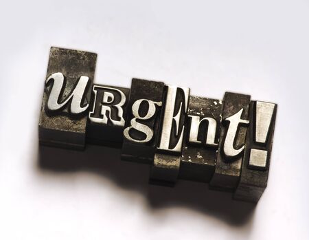 The word Urgent in letterpress typeの写真素材