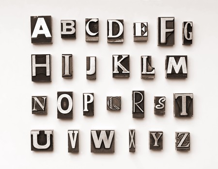 Alphabet photographed using a mix of vintage letterpress characters. Cross-proccessed for a vintage look.の写真素材