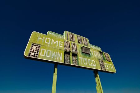 A vintage and dilapidated football scoreboardの写真素材