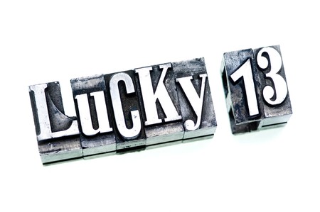 The words Lucky 13 done with letterpress type and cross-processed.の写真素材