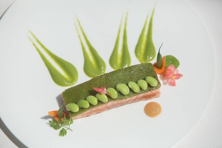 Grilled salmon with peasの写真素材