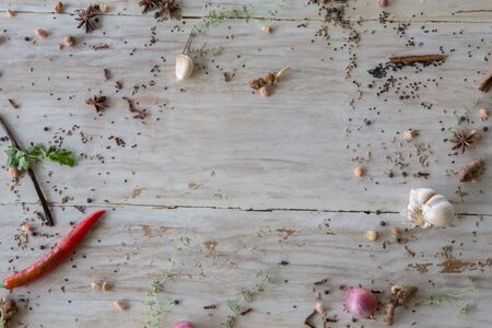 Various spices and herbs on wooden background with copy space flat lay frame composition top view frameの写真素材