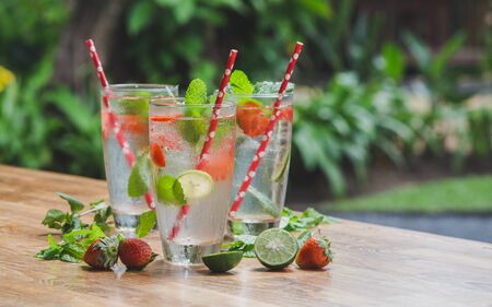 Fresh lemonade or mojito with paper straws. No plastic concept