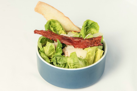 Fresh tasty Bacon caesar salad with mixed vegetablesの写真素材
