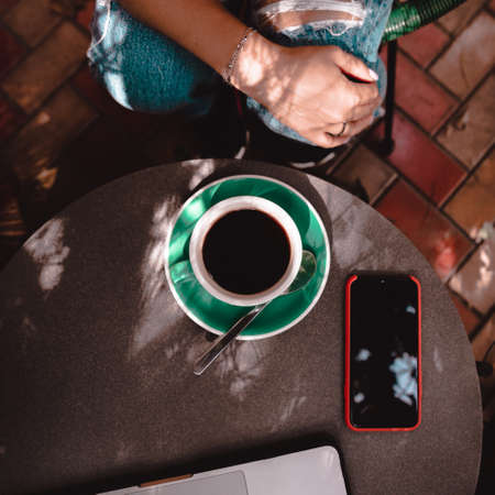person with a cup of coffeeの写真素材
