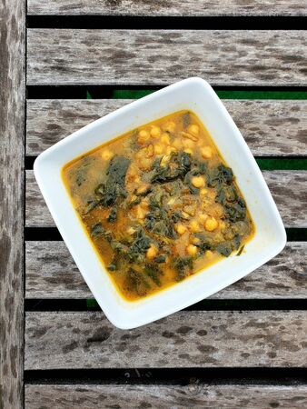 Easter chickpeas with spinach and cod - Traditional spanish meal over a table