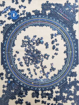 pieces of an incomplete puzzle jigsaw from the universeの写真素材