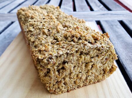 Healthy vegan oat, coconut loaf bread, cake on wooden trayの写真素材