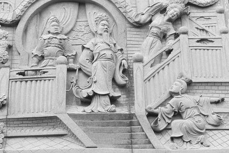 Chinese fable about filial piety by stone carving in temple.の写真素材