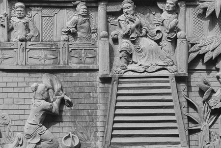 Chinese fable about filial piety by stone carving in temple.の写真素材