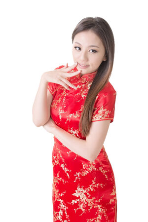 Smiling Chinese woman dress traditional cheongsam at New Year, studio shot isolated on white background の写真素材