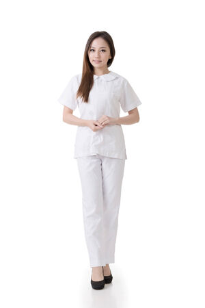 Attractive Asian nurse, woman portrait against white background の写真素材