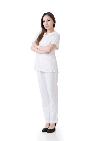 Attractive Asian nurse, woman portrait against white background の写真素材