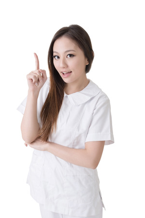 Smiling Asian nurse get and idea, closeup woman portrait isolated on white background の写真素材