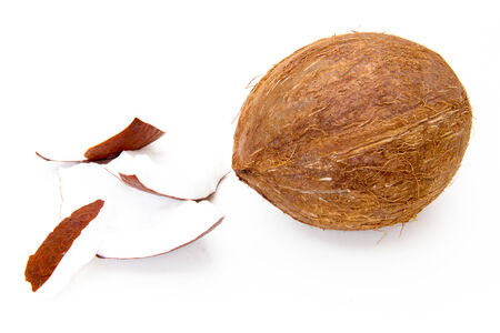 Fresh coconut with pieces on white background 