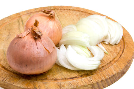 Cut onion on cutting board on white background の写真素材