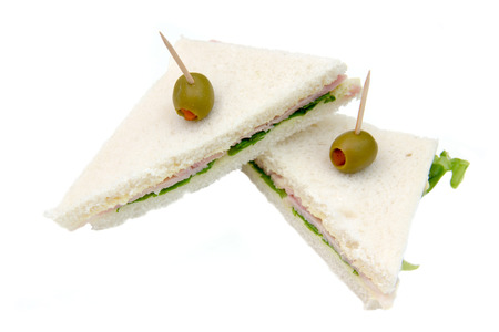 Triangular sandwiches on white background seen up closeの写真素材