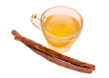 Herbal tea licorice in cup on white background top viewの写真素材