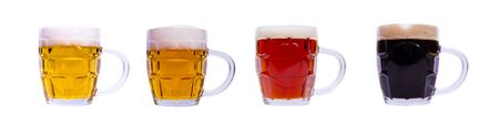 Mugs with different beer in a row on white backgroundの写真素材