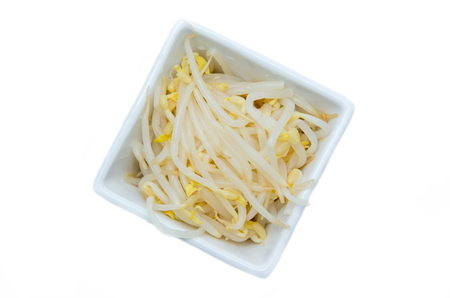 Soybeans on square bowl on a white background seen from aboveの写真素材