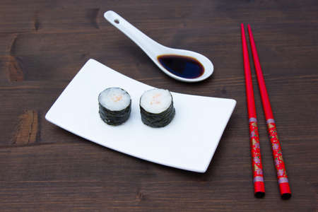 Maki with shrimps on a wooden tableの写真素材