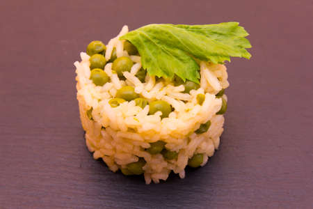 Rice with peas on a slate floorの写真素材