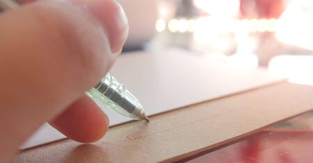 Focus left hand signing a contractの写真素材