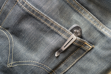 Folding Knife in the pocket jeanの写真素材