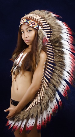 Native american, Indians in traditional dress, standing in profile, American indian Girl, black backgroundの写真素材