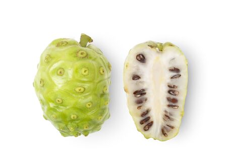 Noni or Morinda Citrifolia fruits with sliced on white background. top viewの写真素材
