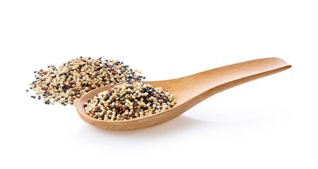 uncooked quinoa isolated on white backgroundの写真素材