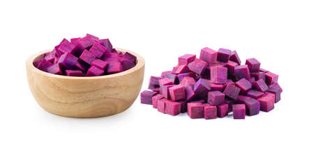purple yams slice in wood bowl  isolated on white background. tfull depth of fieldの写真素材