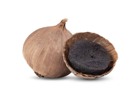 Black garlic bulbs isolated on white backgroundの写真素材