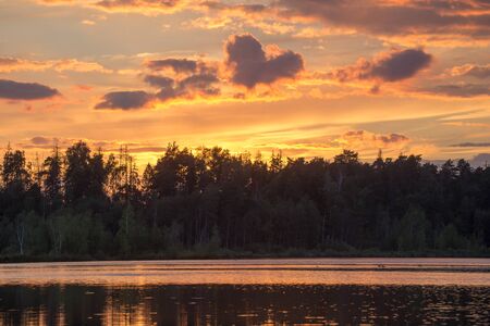 Golden sunset quiet summer evening on Lake Yushinoの写真素材