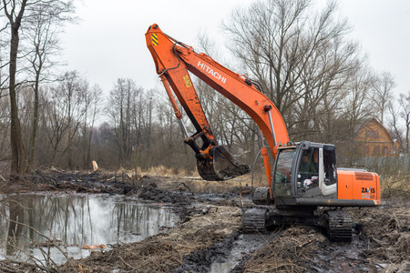Balashikha, Moscow region - November 24, 2017: Cleaning of the Malashka river bed of the left...