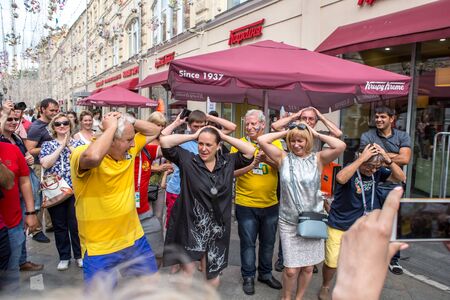 Moscow, Russia - July 14, 2018: The  fans with a flag on Nikolskaya Streetのeditorial素材