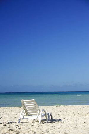 Beach lounger on deserted beachの写真素材