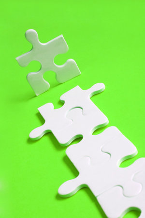 Jigsaw man with piece pathの写真素材