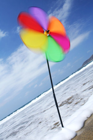 Pinwheel spinning on the shorelineの写真素材