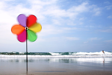 Spinning pinwheel on beachの写真素材