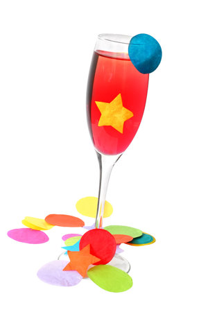 Red cocktail with straw and party confettiの写真素材