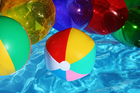 Beach balls in swimming poolの写真素材