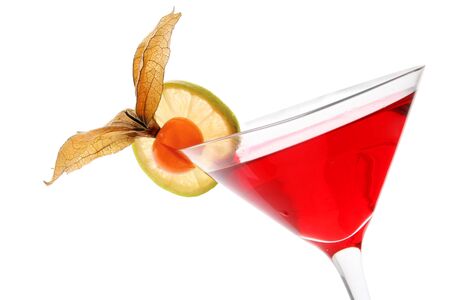 Red cocktail with lime wheeland physallis fruit garnish over whiteの写真素材