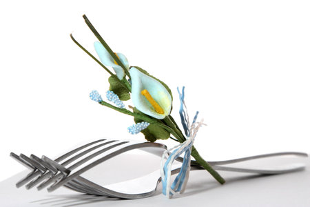 Forks on table presented with small flowersの写真素材