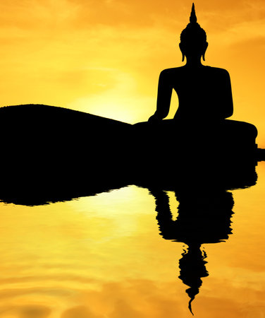 Thai style buddha at sunsetの写真素材