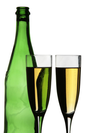 Two champagne glasses and a bottle in silhouetteの写真素材