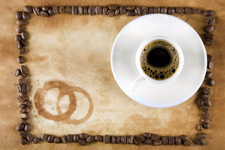 Coffee Cup on old paper with coffee cup and stainsの写真素材