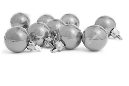 Small Christmas baubles in high key mono with a white backgroundの写真素材
